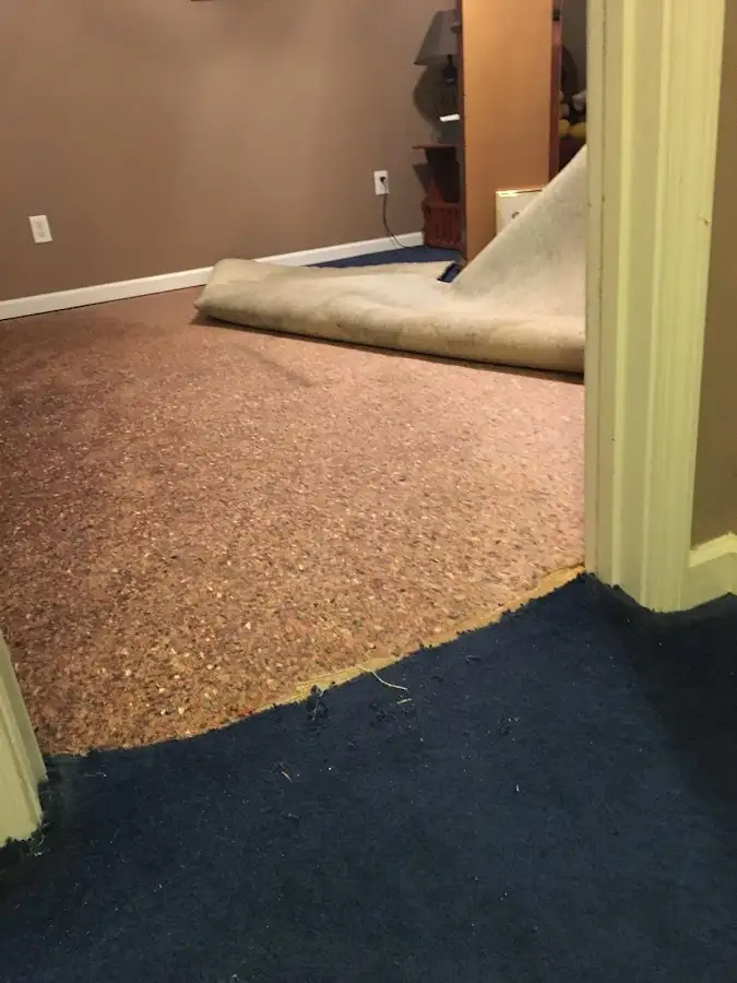 Carpet pad removal revealing water damage during Water Mitigation Services in Wailua Homesteads